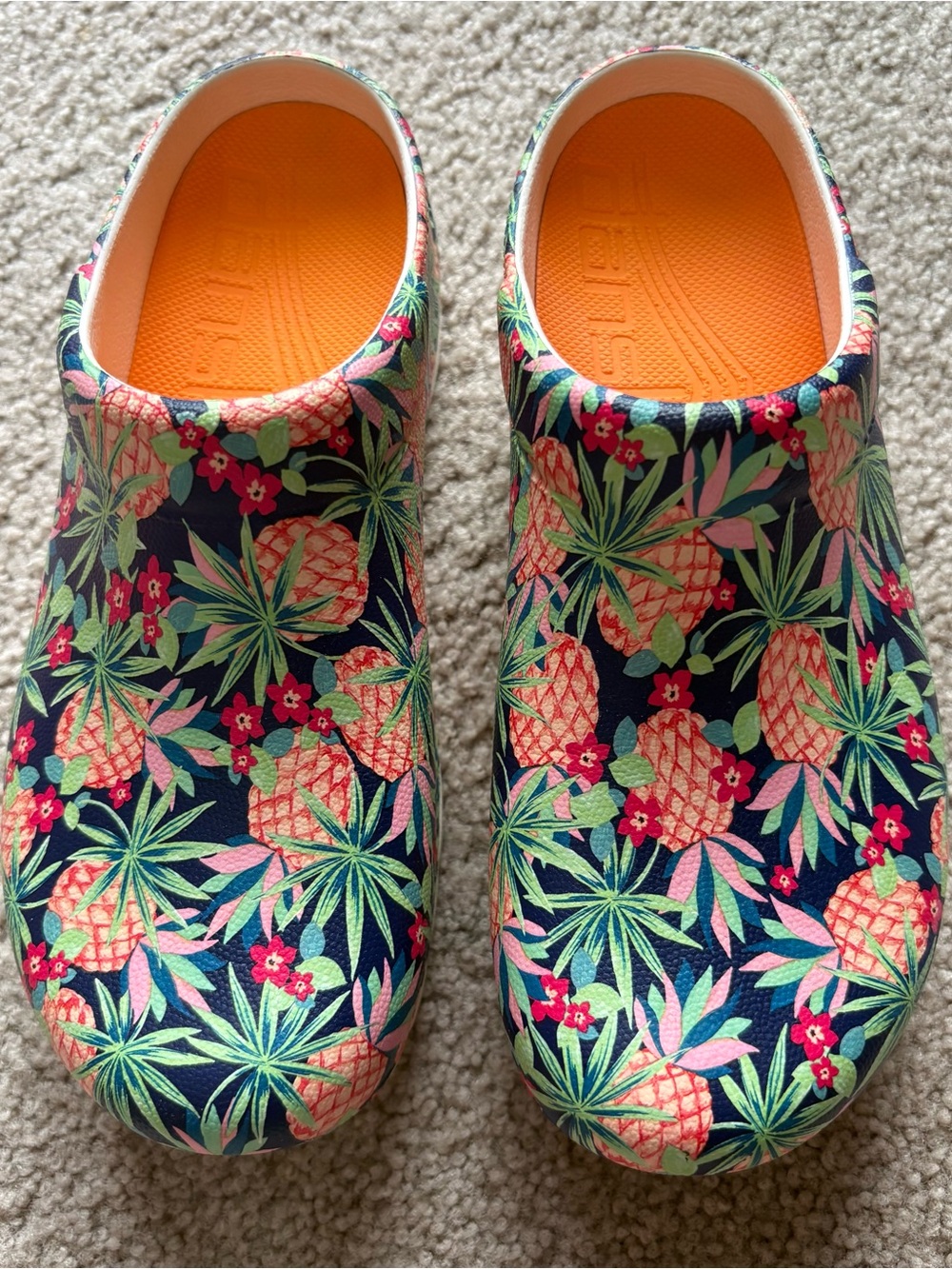 Dansko Floral Pineapple Clogs in Navy, Orange, Pink, Green